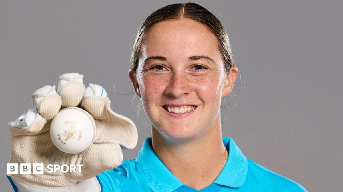 Player holding a cricket ball with gloves Player holding a cricket ball with gloves