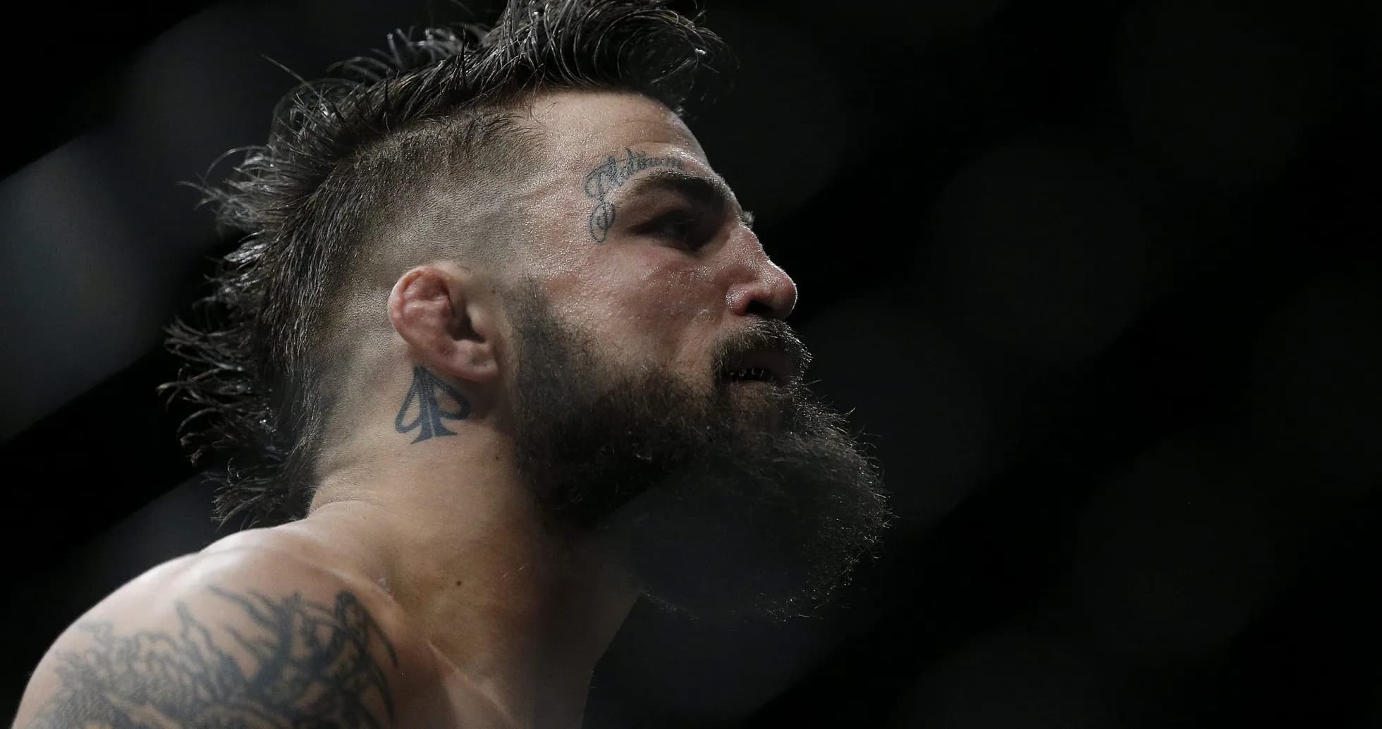 Close-up of a fighter with tattoos in profile Close-up of a fighter with tattoos in profile