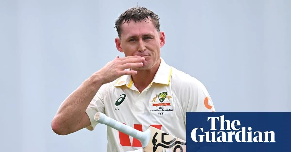 Cricketer acknowledging the crowd with bat in hand Cricketer acknowledging the crowd with bat in hand
