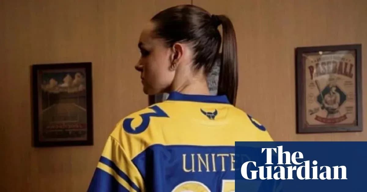 Person wearing a yellow and blue sports jersey Person wearing a yellow and blue sports jersey