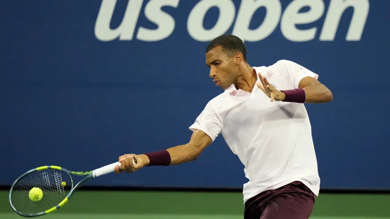 Player hitting a backhand during US Open match Player hitting a backhand during US Open match