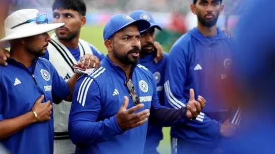 Coach addressing cricket team during strategy discussion Coach addressing cricket team during strategy discussion