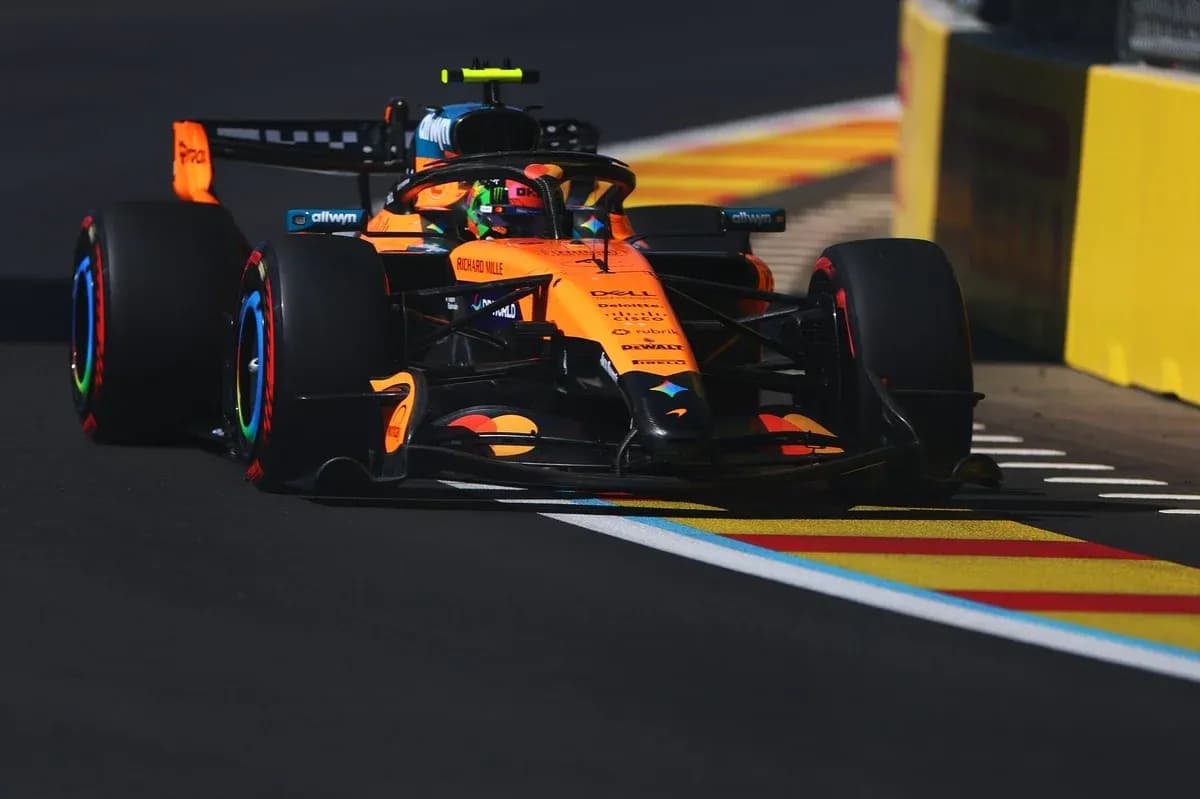 McLaren Formula 1 car racing on track McLaren Formula 1 car racing on track