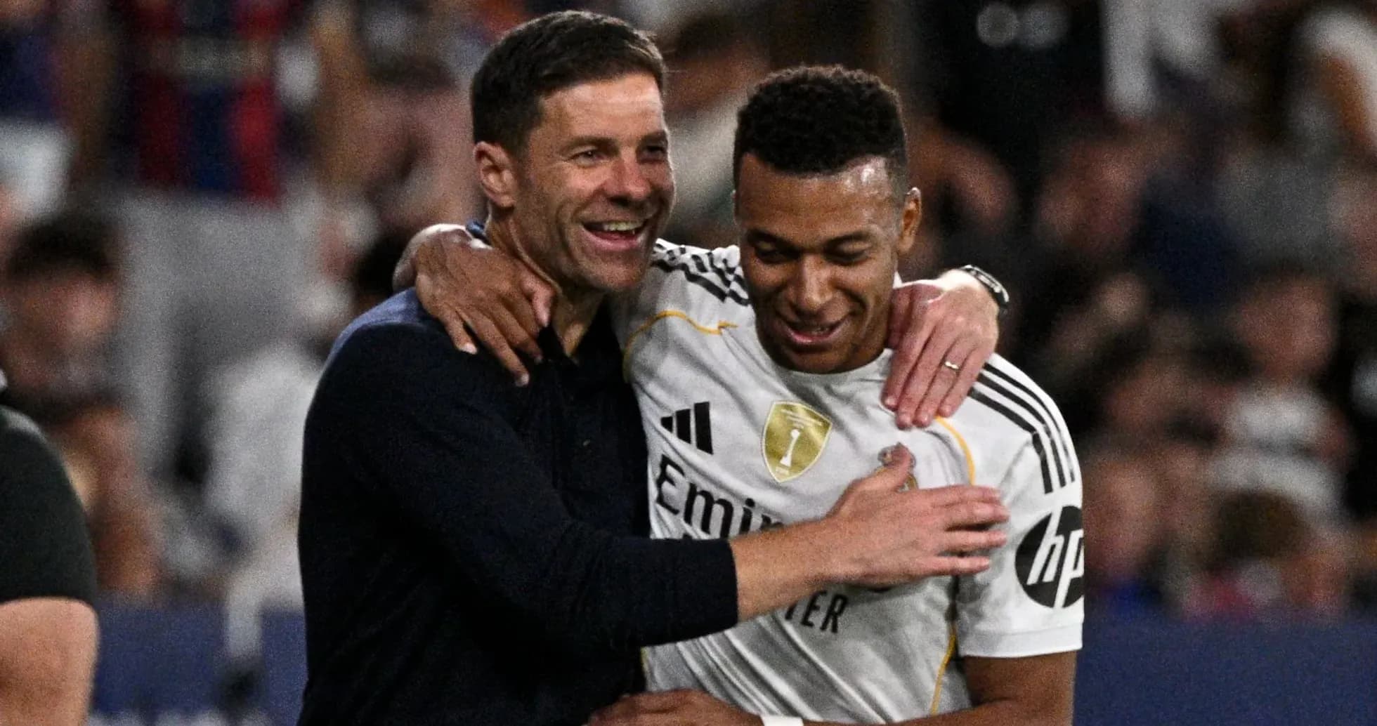 Coach and player celebrating together on the field Coach and player celebrating together on the field