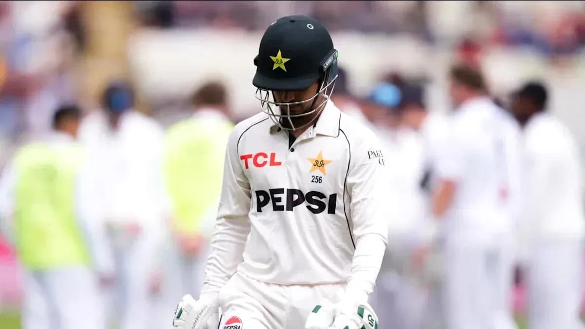 Cricketer from Pakistan walking off the field Cricketer from Pakistan walking off the field