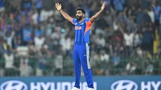 Cricketer celebrating in front of cheering crowd Cricketer celebrating in front of cheering crowd