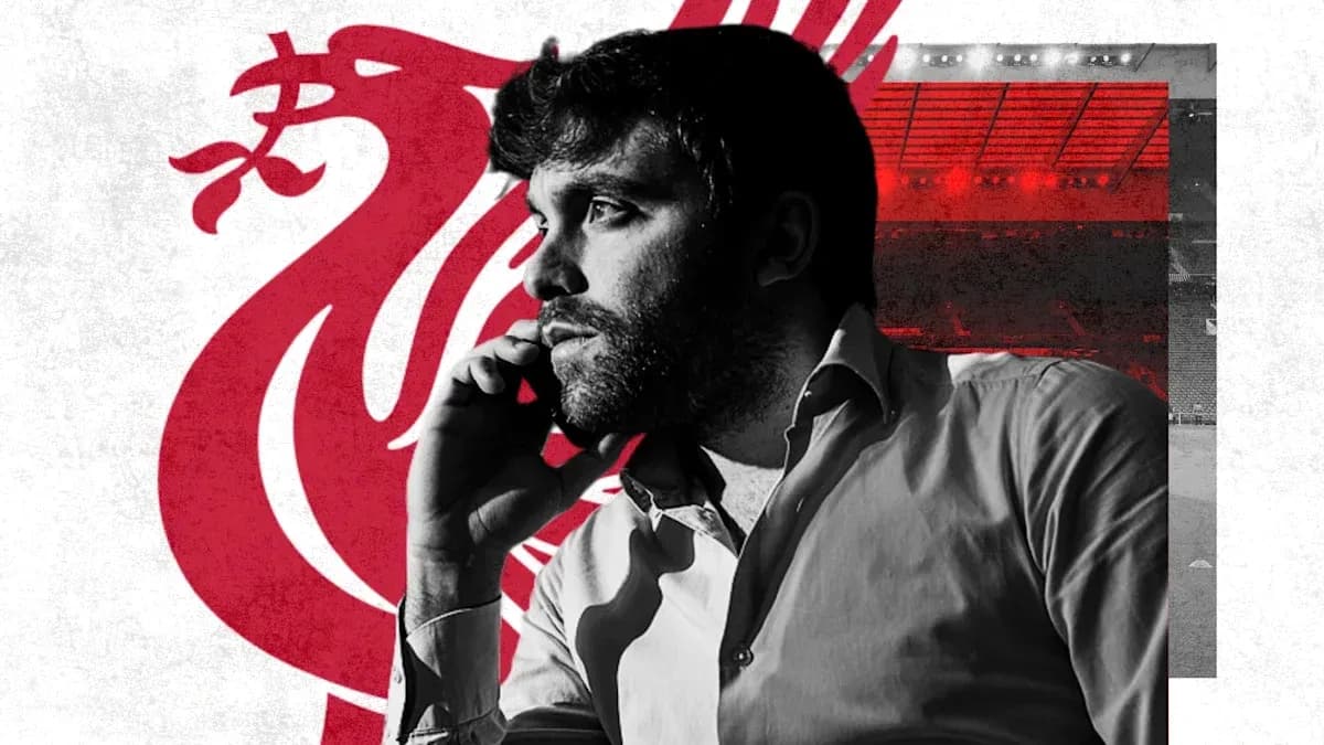 Man talking on phone with Liverpool logo background Man talking on phone with Liverpool logo background