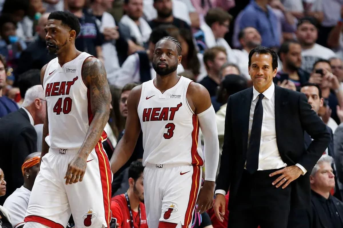 Miami Heat players and coach during a game Miami Heat players and coach during a game