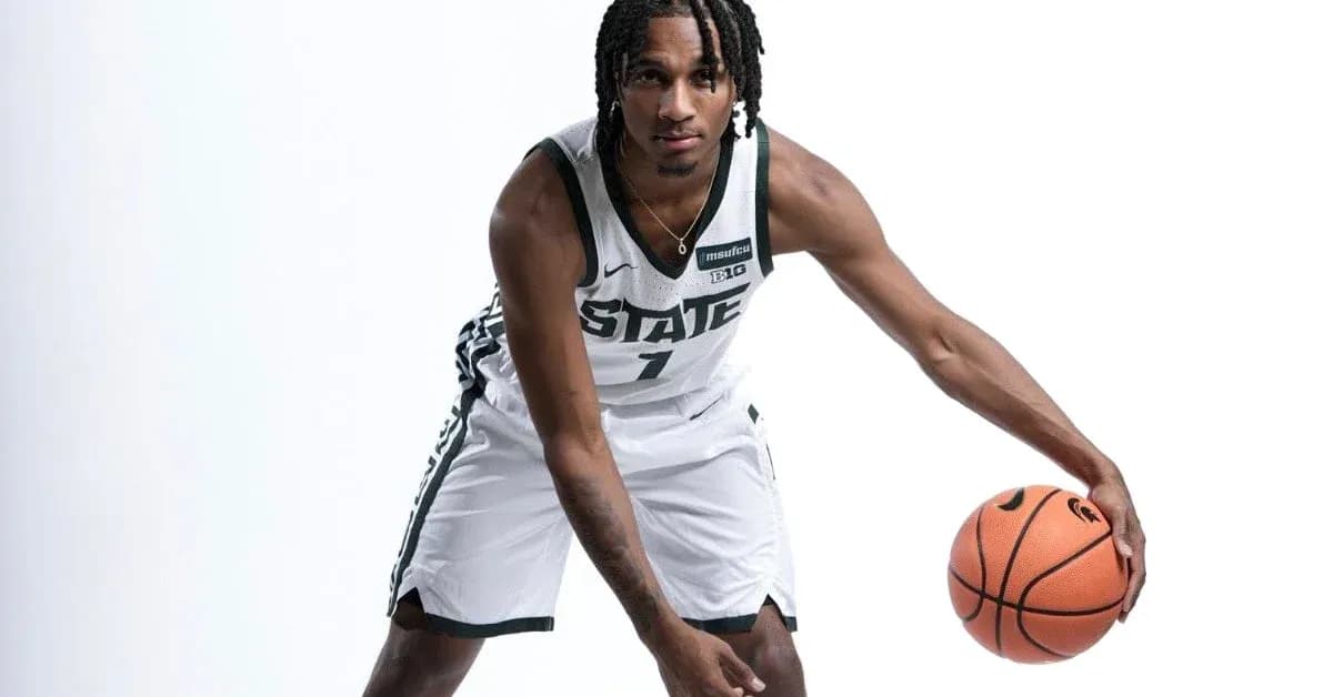 Basketball player dribbling ball in team uniform Basketball player dribbling ball in team uniform