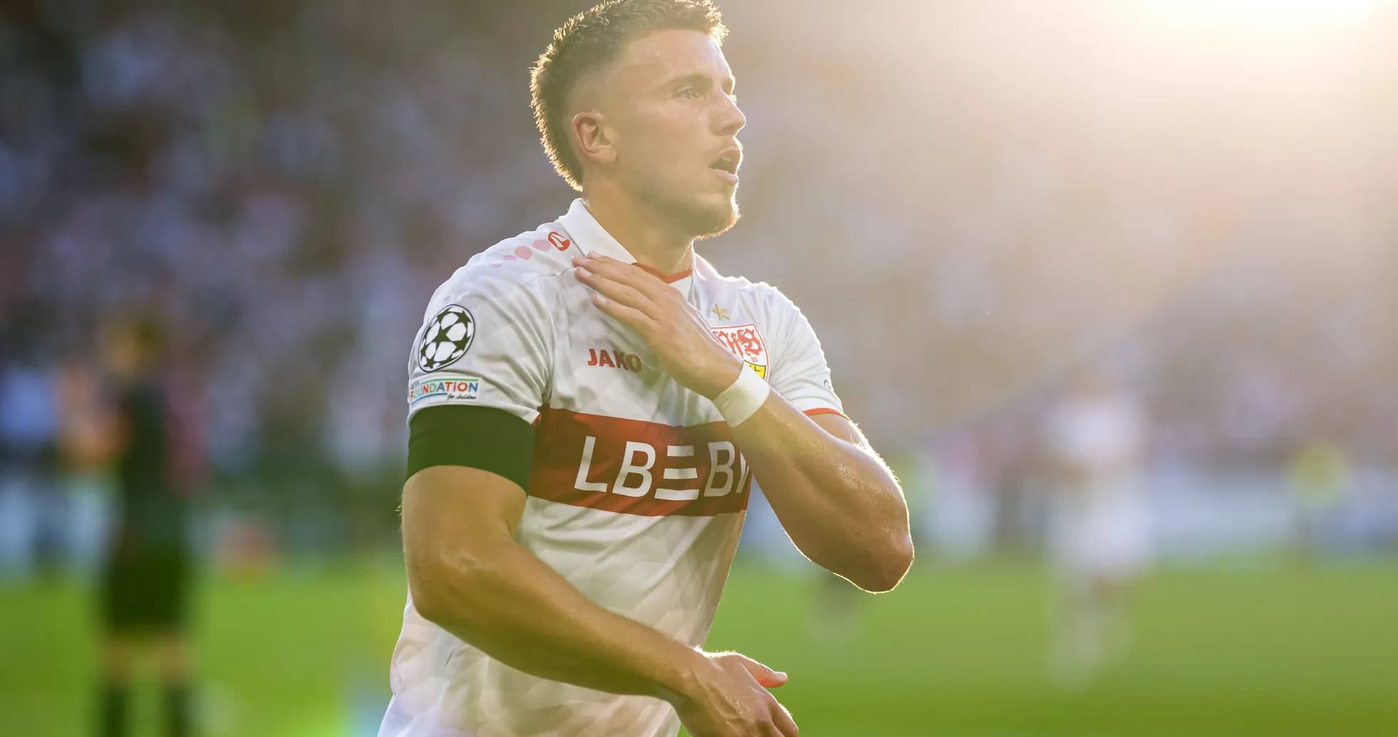 Player celebrating with hand on chest after match Player celebrating with hand on chest after match