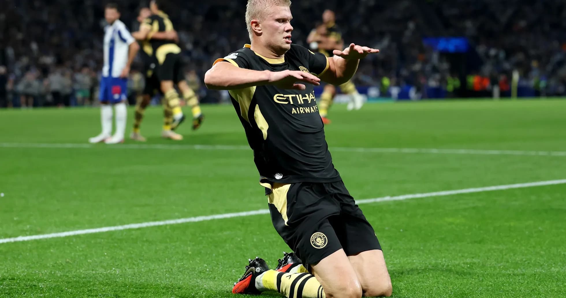 Player celebrating on knees after scoring a goal Player celebrating on knees after scoring a goal