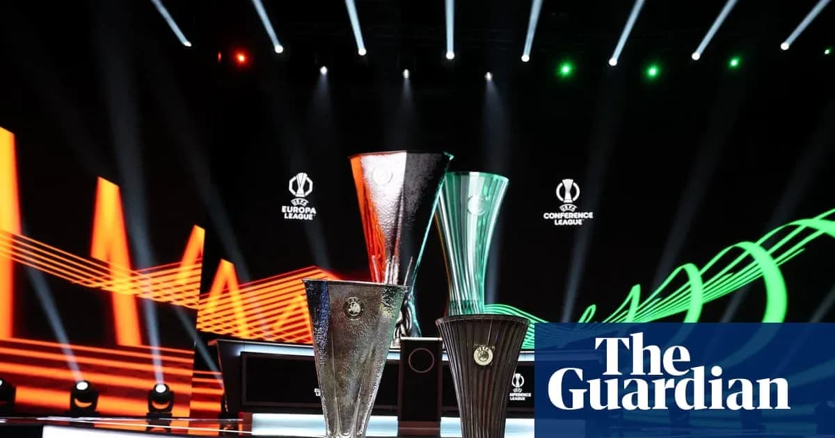Three UEFA trophies displayed on stage Three UEFA trophies displayed on stage