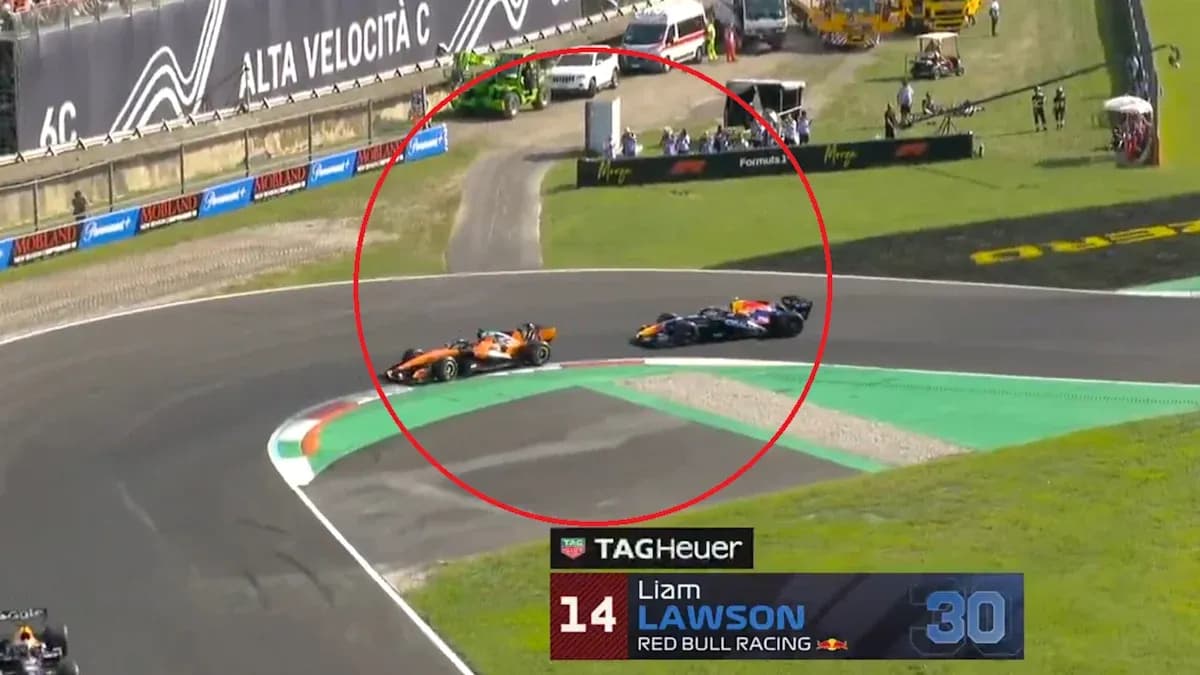 Two Formula 1 cars racing on track at turn Two Formula 1 cars racing on track at turn