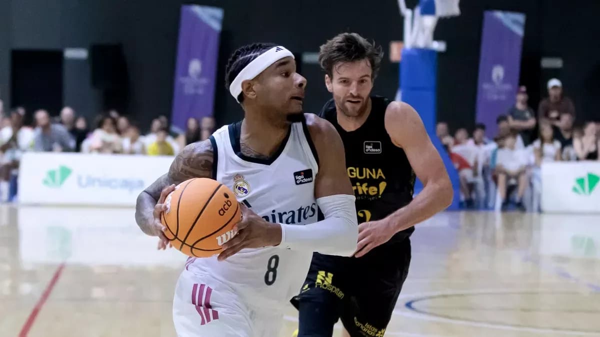 Player dribbling basketball with opponent chasing Player dribbling basketball with opponent chasing