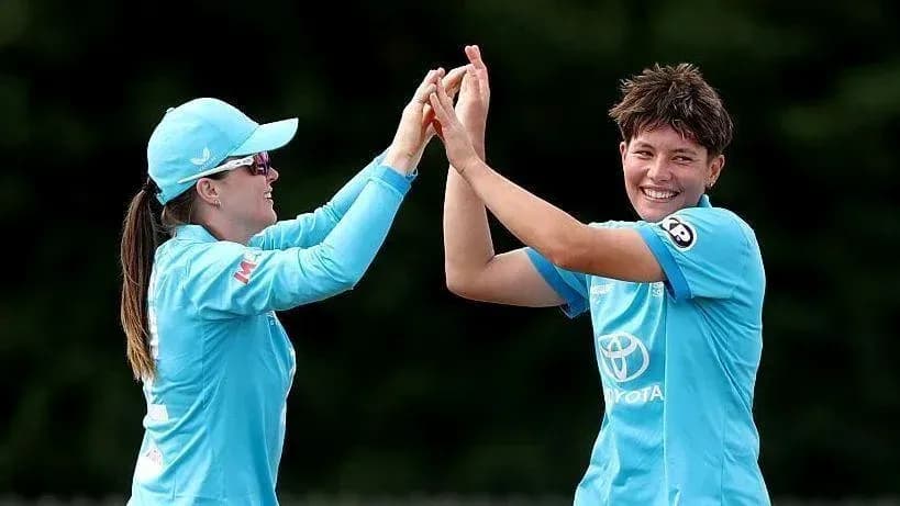 Two players celebrating a wicket during match Two players celebrating a wicket during match