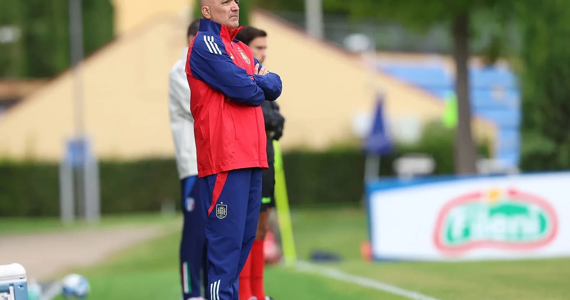 Coach observing players during training session Coach observing players during training session