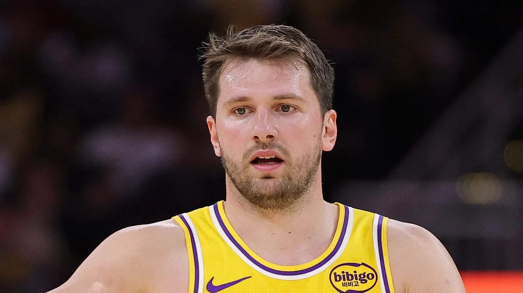 Player in yellow jersey during basketball game Player in yellow jersey during basketball game