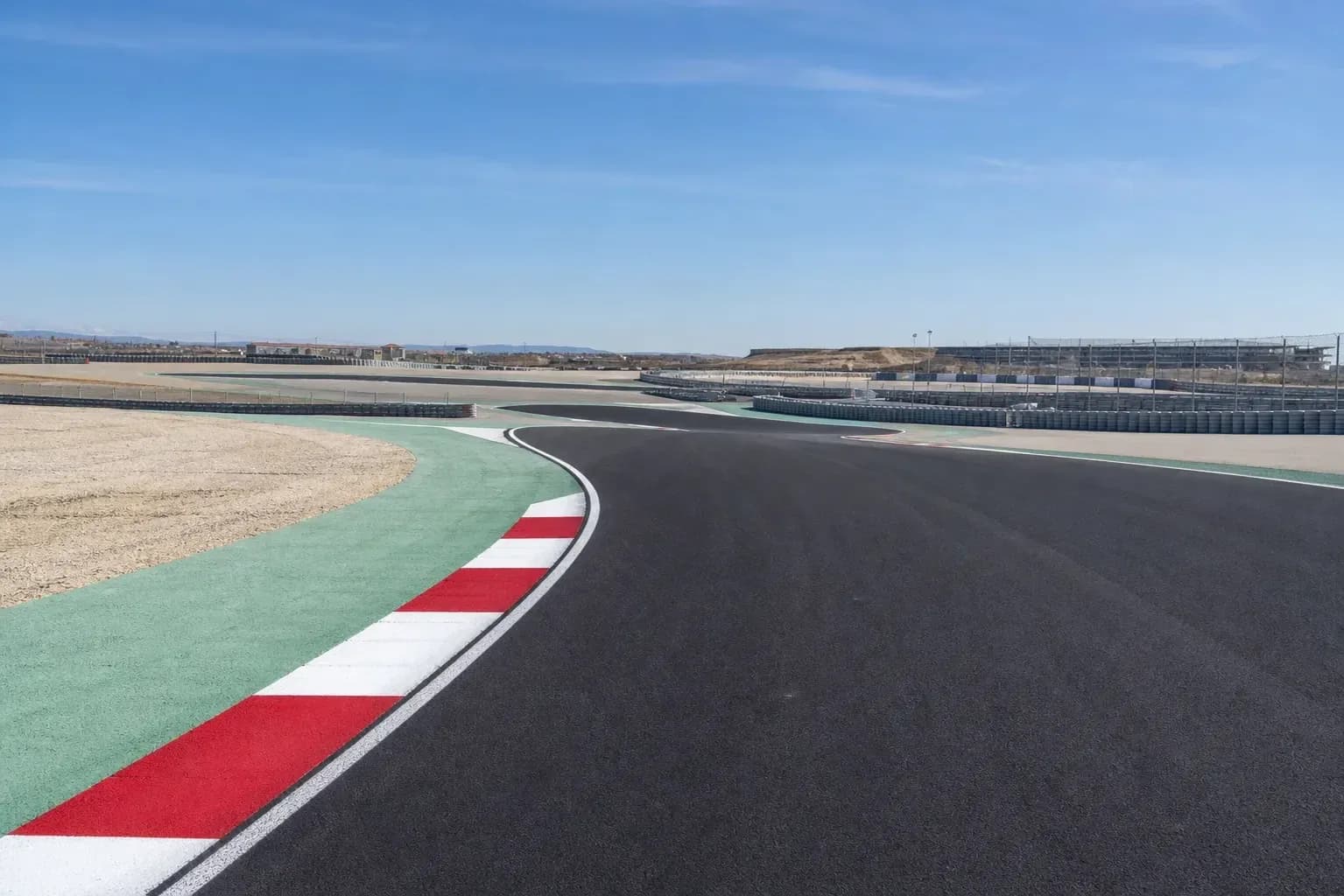Curved section of a racetrack with runoff area Curved section of a racetrack with runoff area
