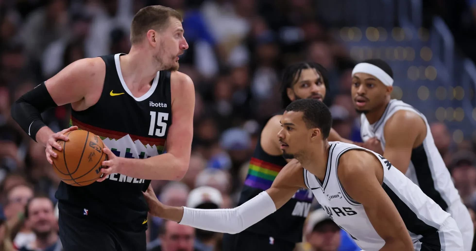 Player dribbling basketball during competitive game Player dribbling basketball during competitive game