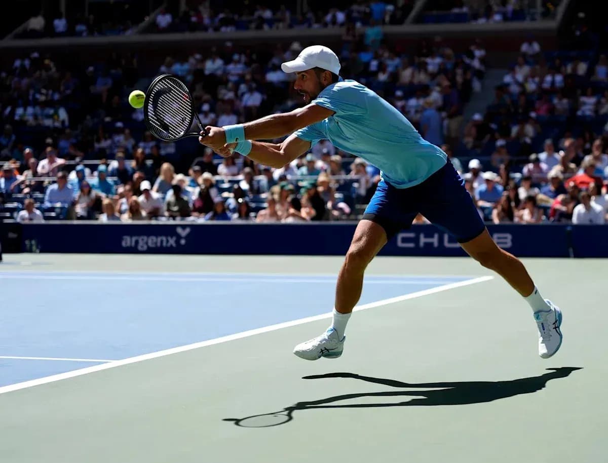 Player lunging to hit a tennis ball during match Player lunging to hit a tennis ball during match