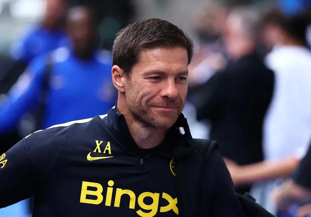 Coach walking in training gear before match Coach walking in training gear before match