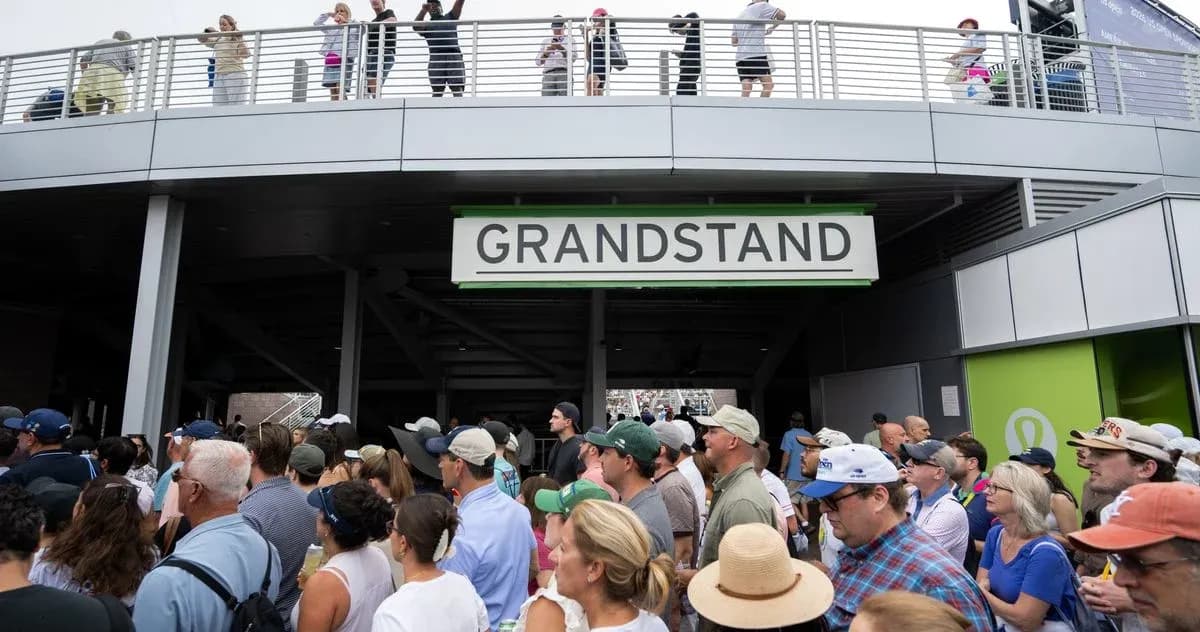 Crowd gathering at entrance to grandstand area Crowd gathering at entrance to grandstand area