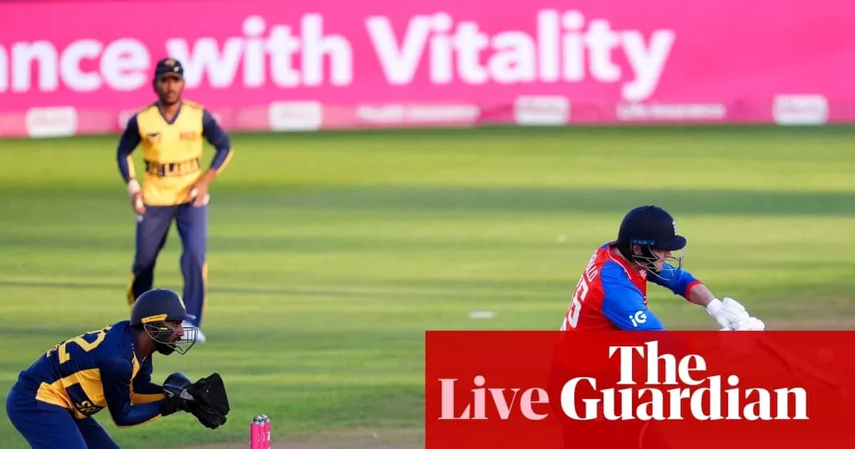 Cricketer batting while wicketkeeper crouches behind Cricketer batting while wicketkeeper crouches behind