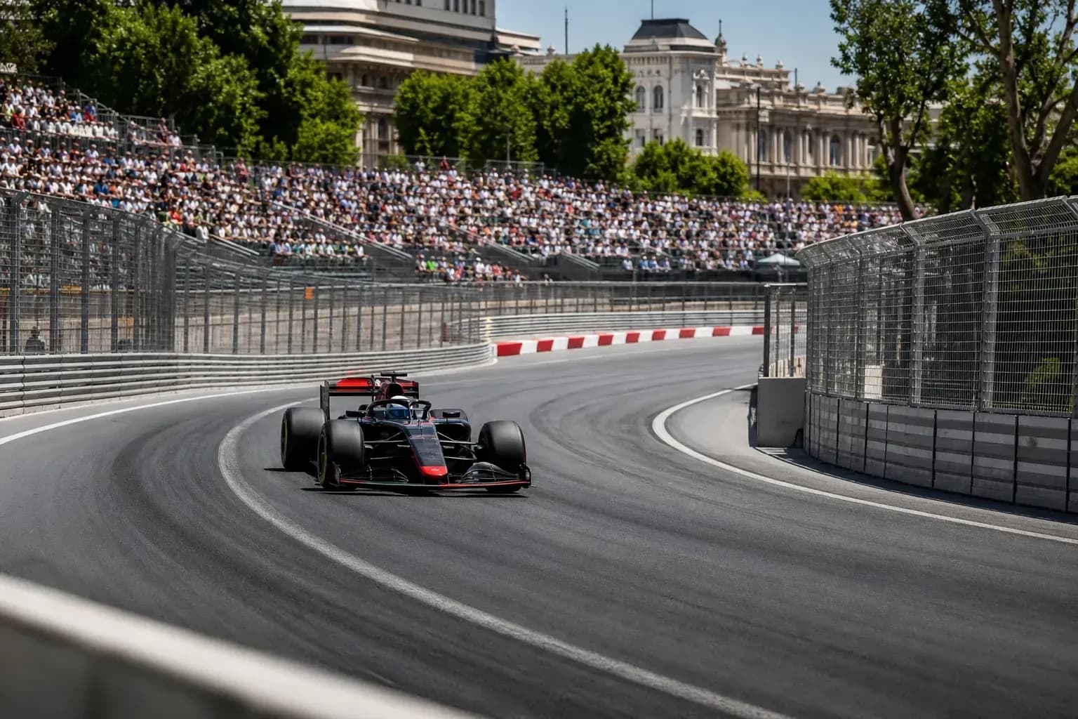 Formula 1 car navigating a turn on race track Formula 1 car navigating a turn on race track