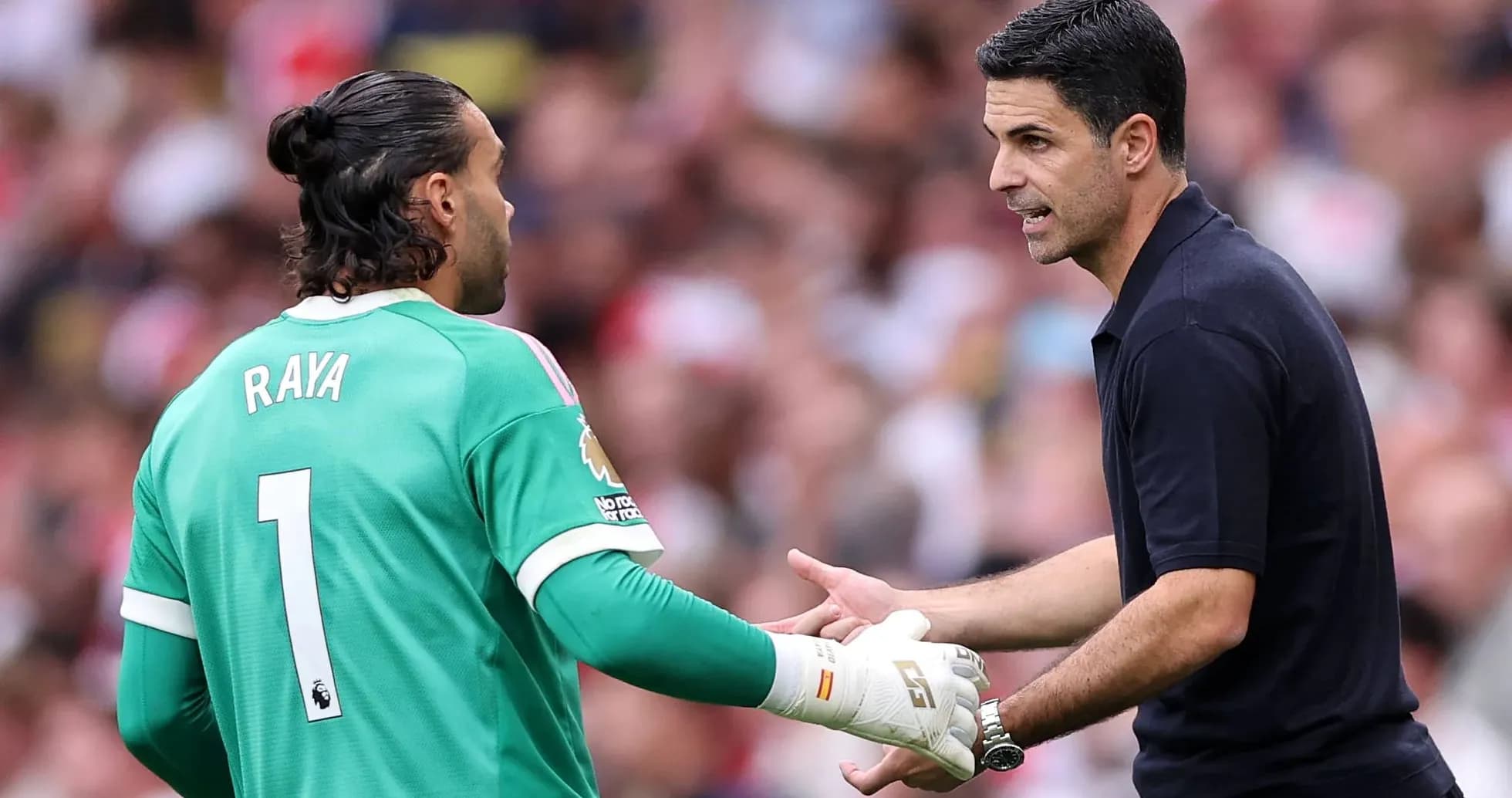Goalkeeper and manager discussing during match Goalkeeper and manager discussing during match