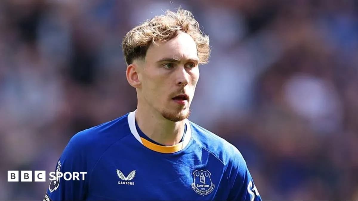 Player wearing Everton kit on the field Player wearing Everton kit on the field