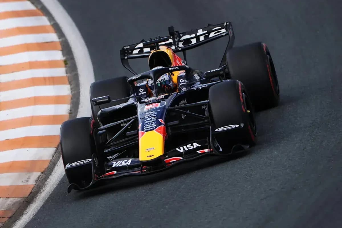 Formula 1 car navigating a curved track Formula 1 car navigating a curved track