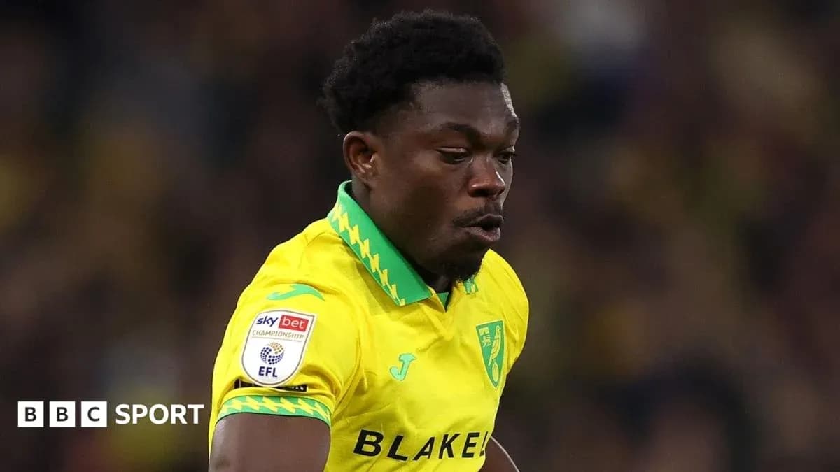 Player in yellow kit running on the pitch Player in yellow kit running on the pitch