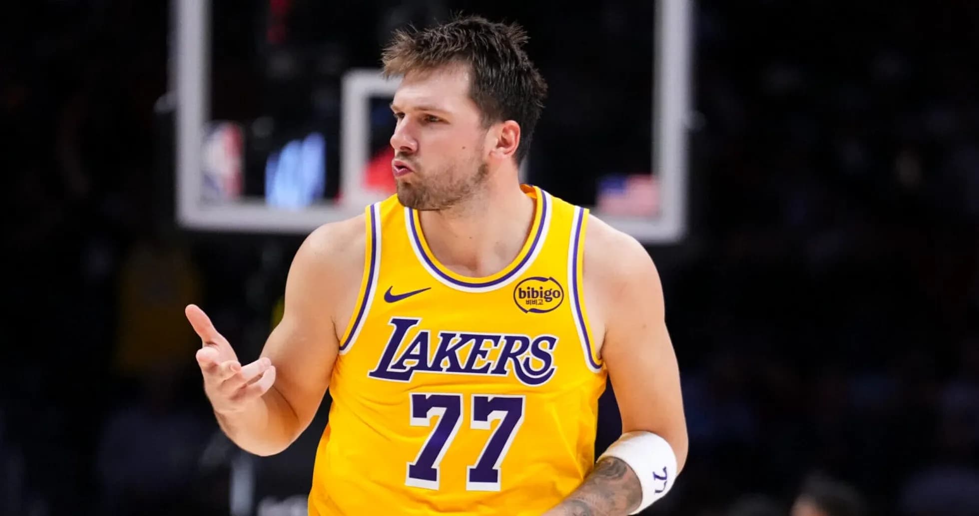 Player celebrating in yellow Lakers jersey during game Player celebrating in yellow Lakers jersey during game