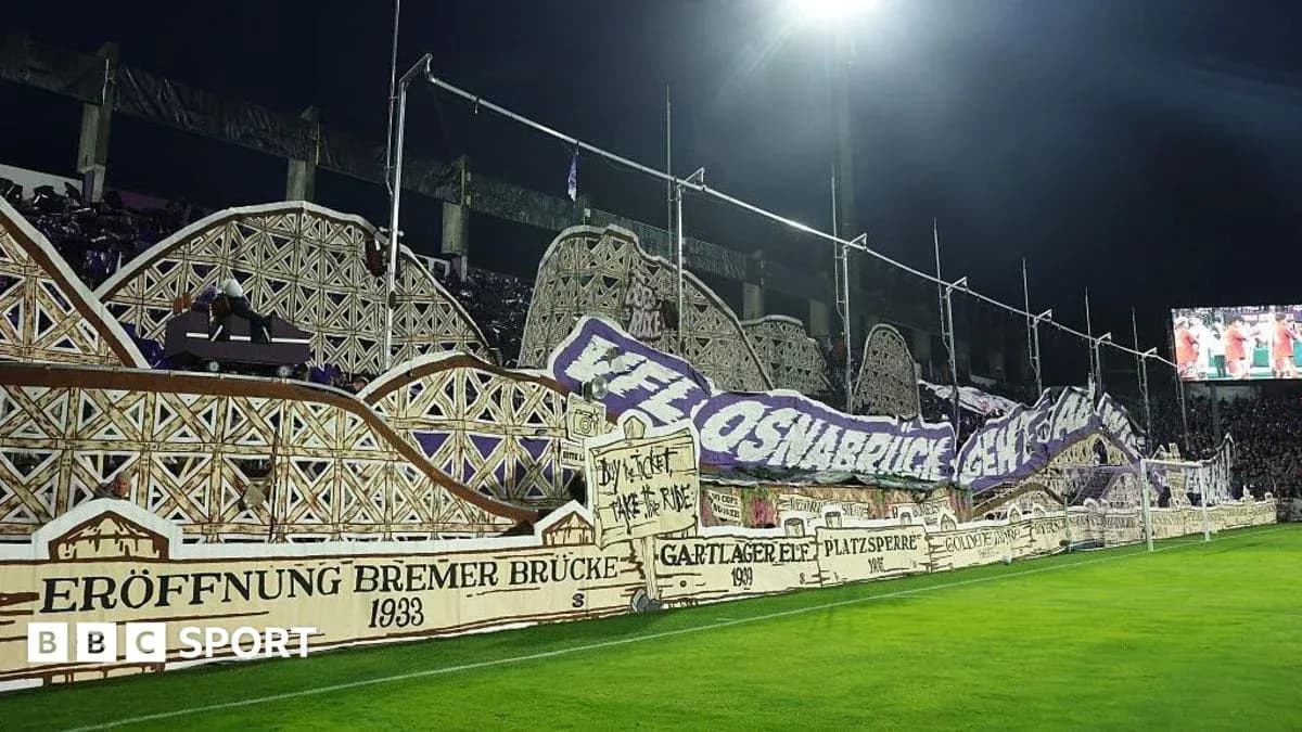 Fan banner display at stadium during night match Fan banner display at stadium during night match