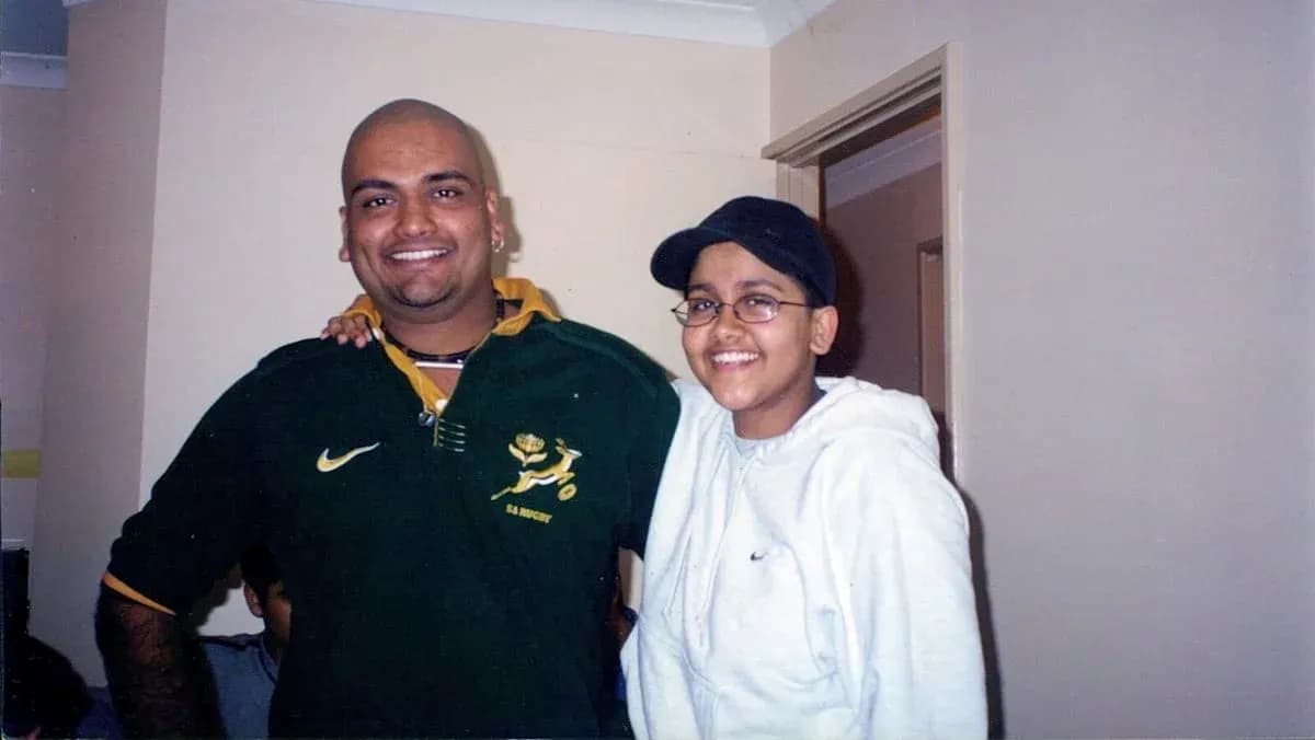 Two people smiling together in a room Two people smiling together in a room