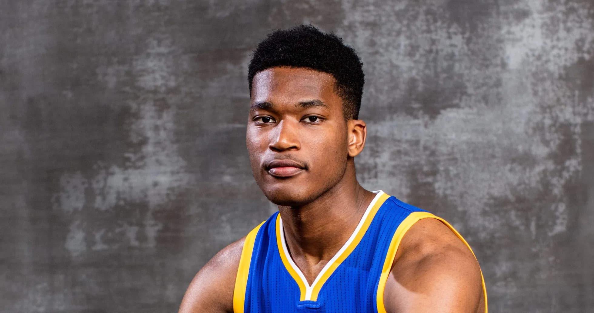 Basketball player posing in team jersey Basketball player posing in team jersey