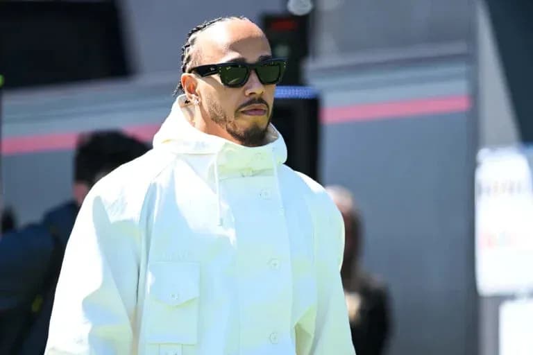 Man in white jacket and sunglasses walking Man in white jacket and sunglasses walking
