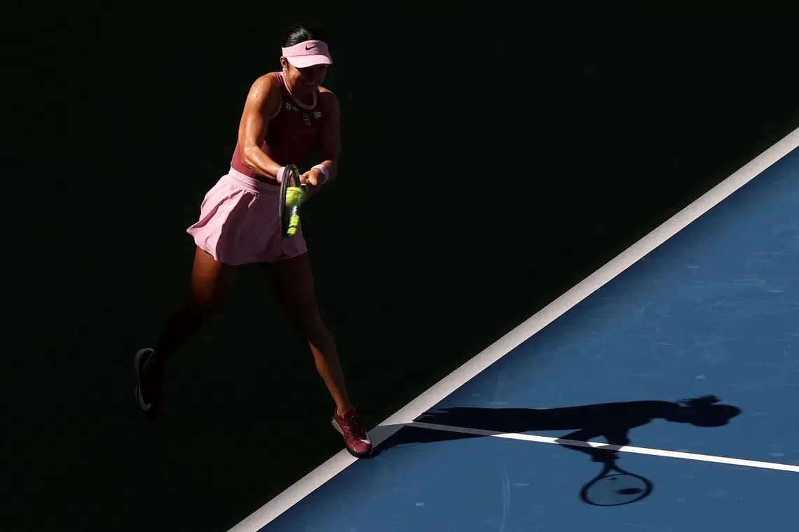 Player hitting a tennis ball on the court Player hitting a tennis ball on the court