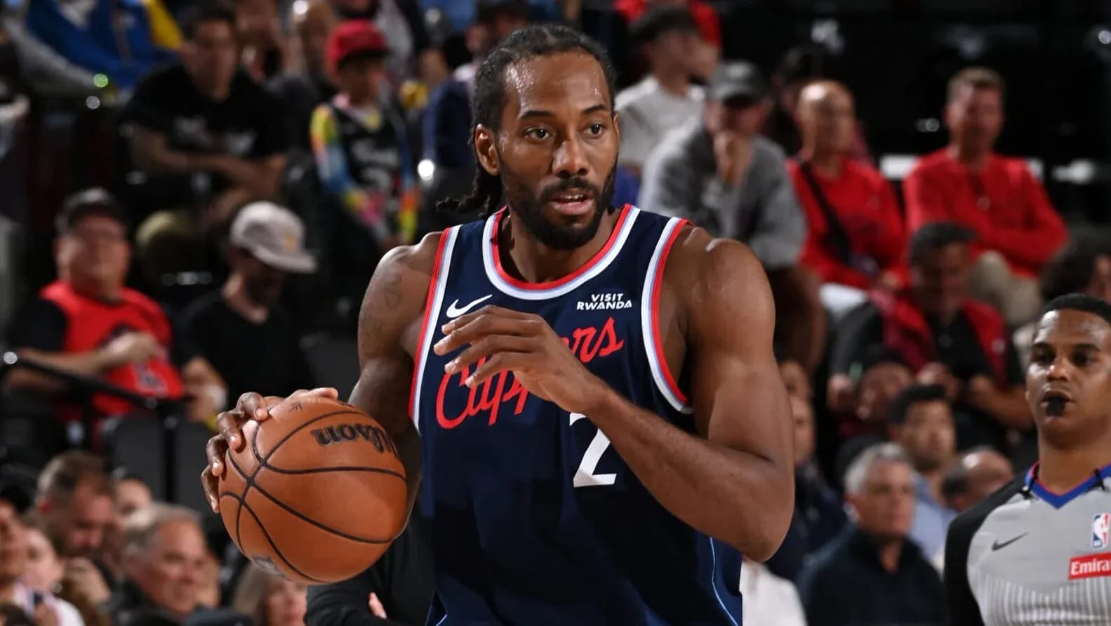 Kawhi Leonard dribbling basketball during game Kawhi Leonard dribbling basketball during game