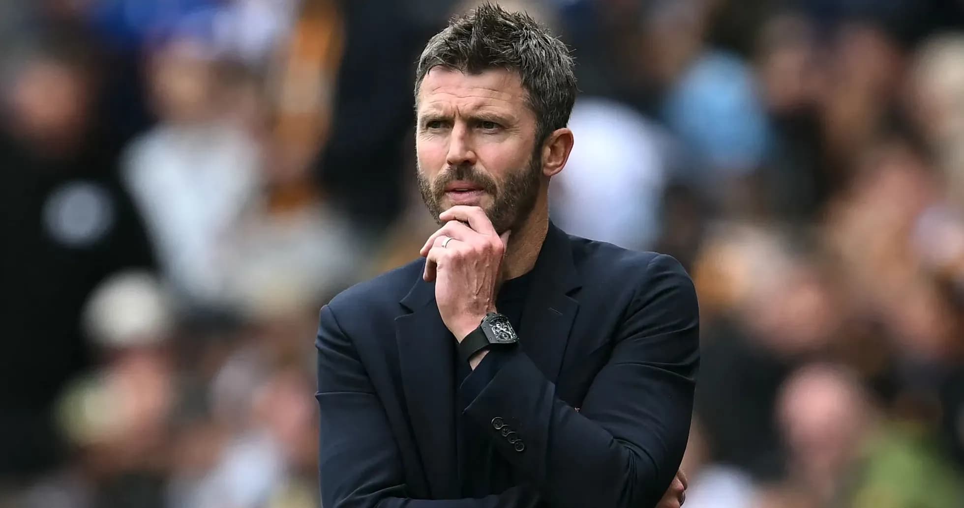 Coach observing match with thoughtful expression Coach observing match with thoughtful expression