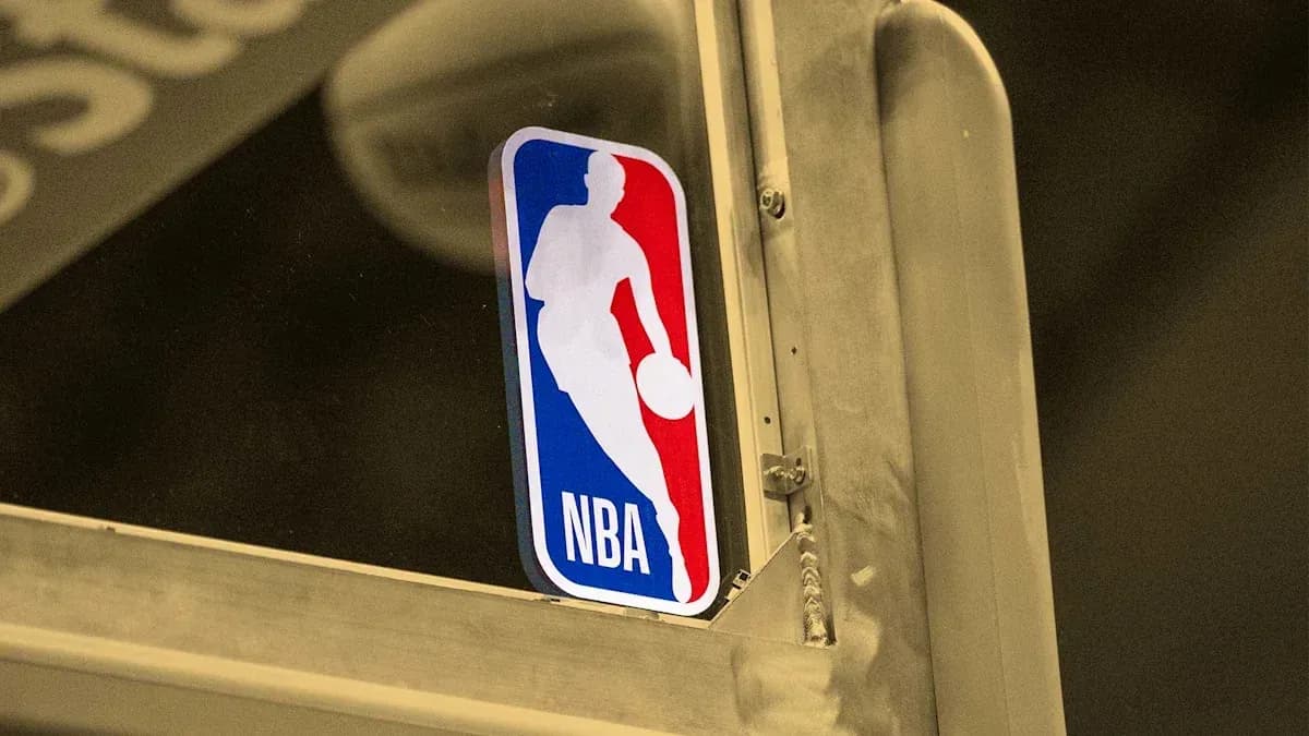 NBA logo displayed on a basketball hoop NBA logo displayed on a basketball hoop