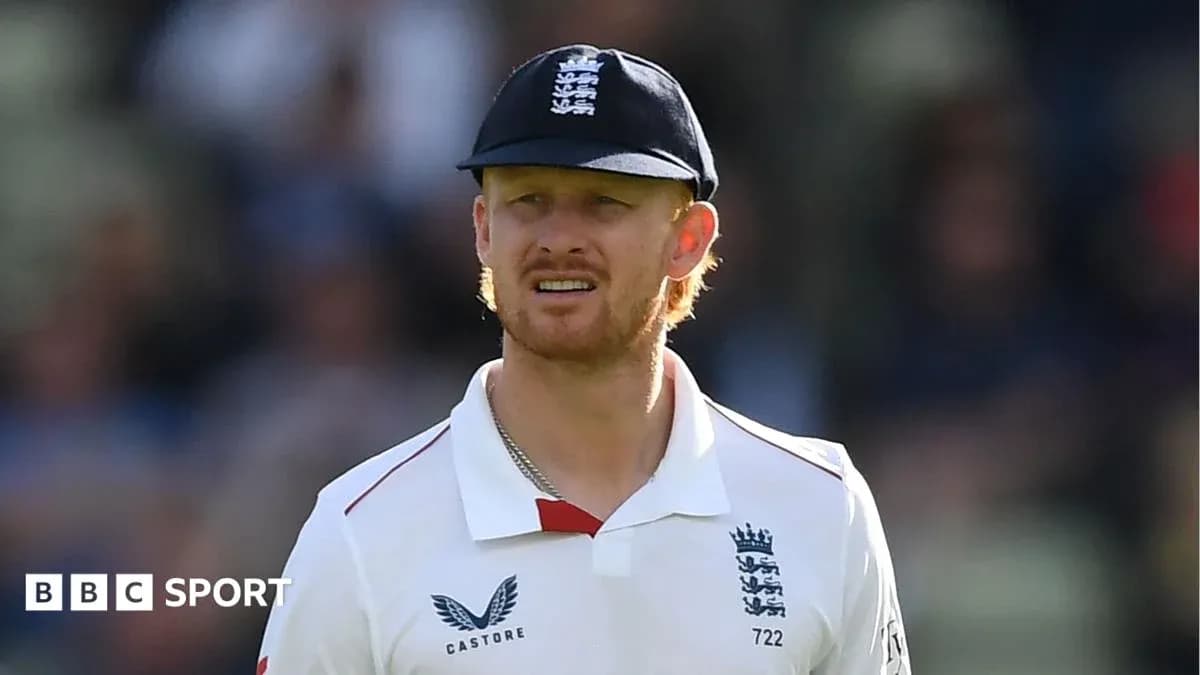 Cricketer wearing England team uniform and cap Cricketer wearing England team uniform and cap