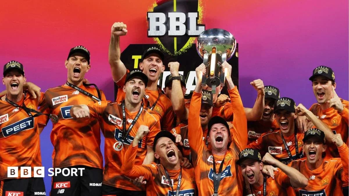 Team celebrating with trophy after BBL championship victory Team celebrating with trophy after BBL championship victory