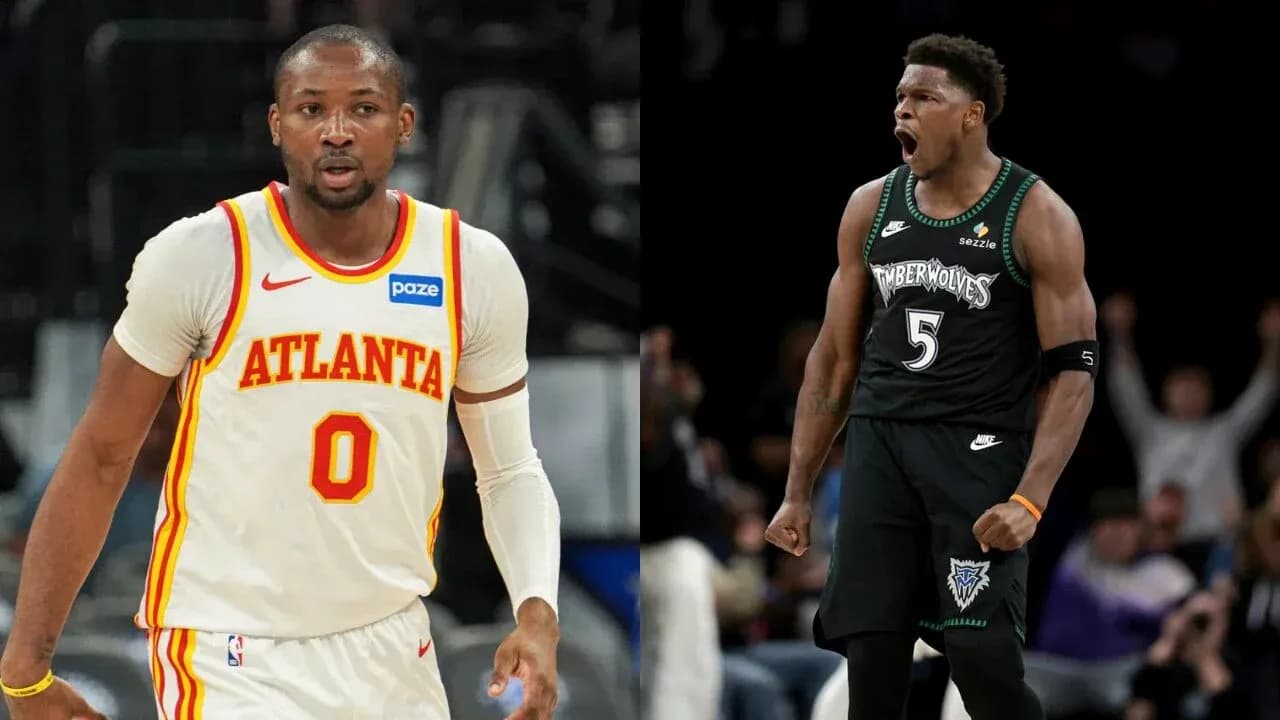 Two basketball players in team jerseys during game Two basketball players in team jerseys during game