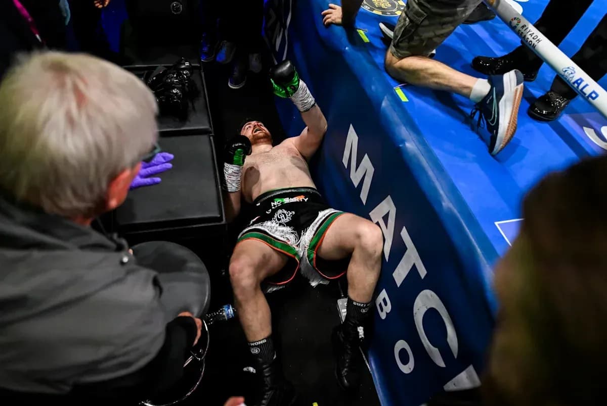 Boxer lying on the floor after a match Boxer lying on the floor after a match
