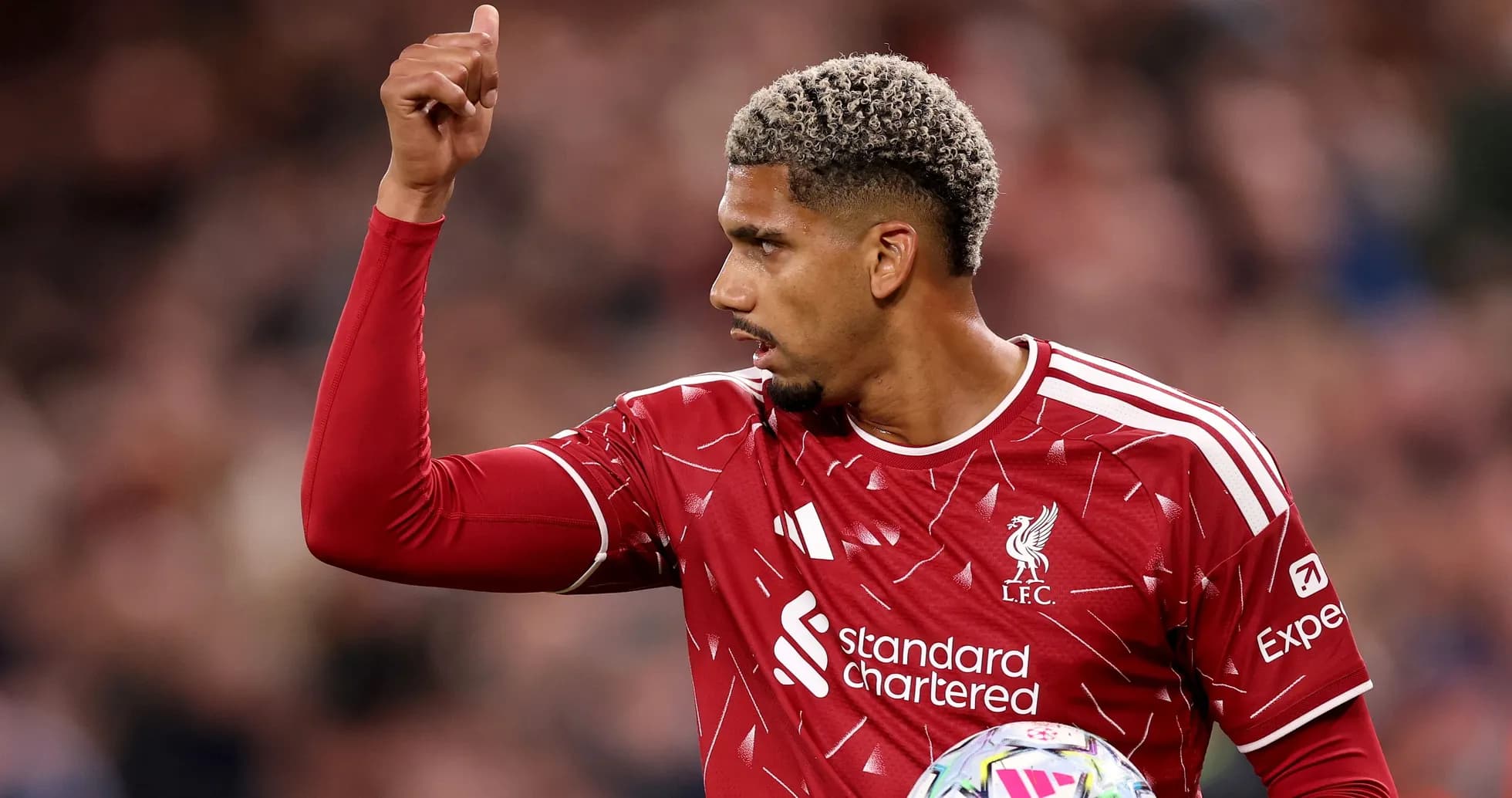 Liverpool player signaling during match action Liverpool player signaling during match action