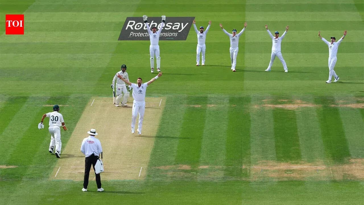Cricket players celebrating an appeal for a wicket Cricket players celebrating an appeal for a wicket