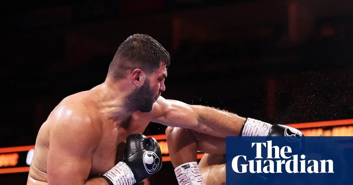 Boxer delivering a punch during a match Boxer delivering a punch during a match