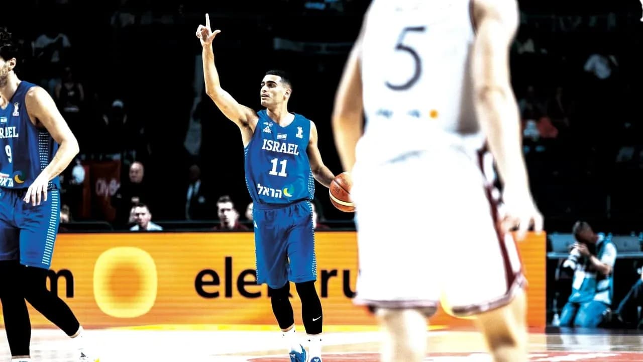 Player 11 of Israel signaling during basketball game Player 11 of Israel signaling during basketball game