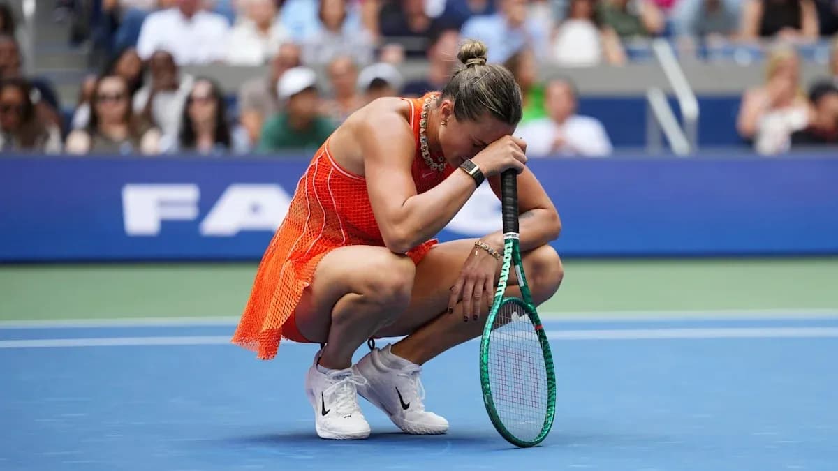Tennis player kneeling on court holding racket Tennis player kneeling on court holding racket